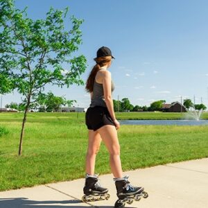 girl rollerblading in park - Marshall Minnesota
