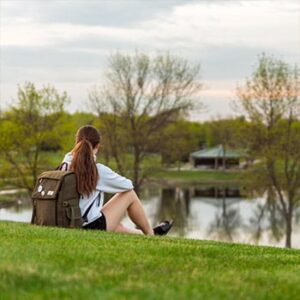girl sitting by pond in Independence Park - Marshall MN