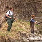 boys fishing in river near Marshall MN