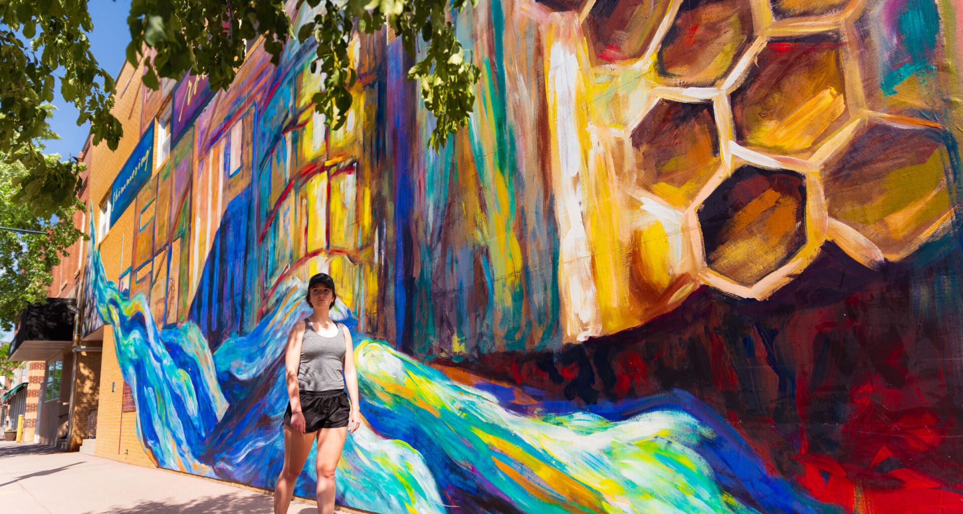 woman walking by Art Mural