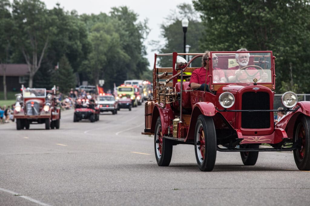 Old fire truck in parade during Sounds of Summer