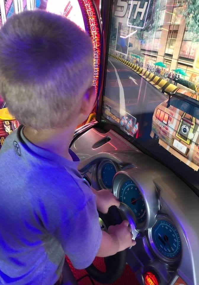 AJ's Arcade - Kid playing Race Car Game